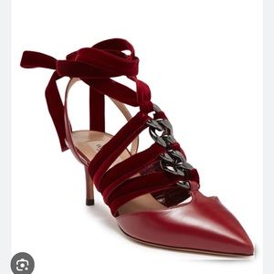 Valentino Garavani Chain embellished burgundy leather pumps with velvet trim.